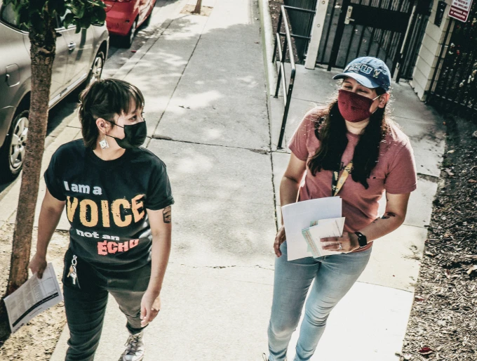 La Familia women with mask